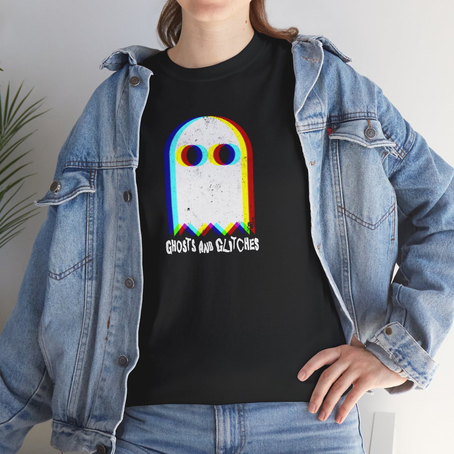 Unisex “Ghosts and Glitches” t-shirt featuring pixel ghosts and retro video game design — worn by an Halloween and video games fan, BimBangDesign