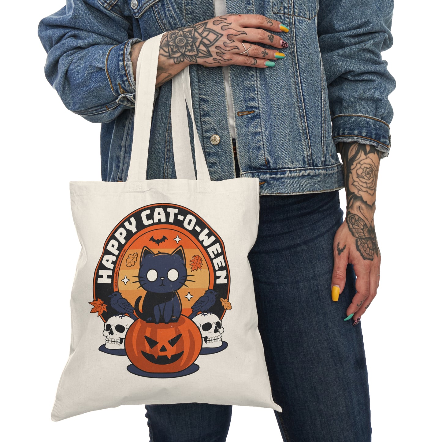 Happy Cat-O-Ween tote bag featuring cartoon cat and Halloween design — cute spooky reusable bag used by a halloween fan, BimBangDesign