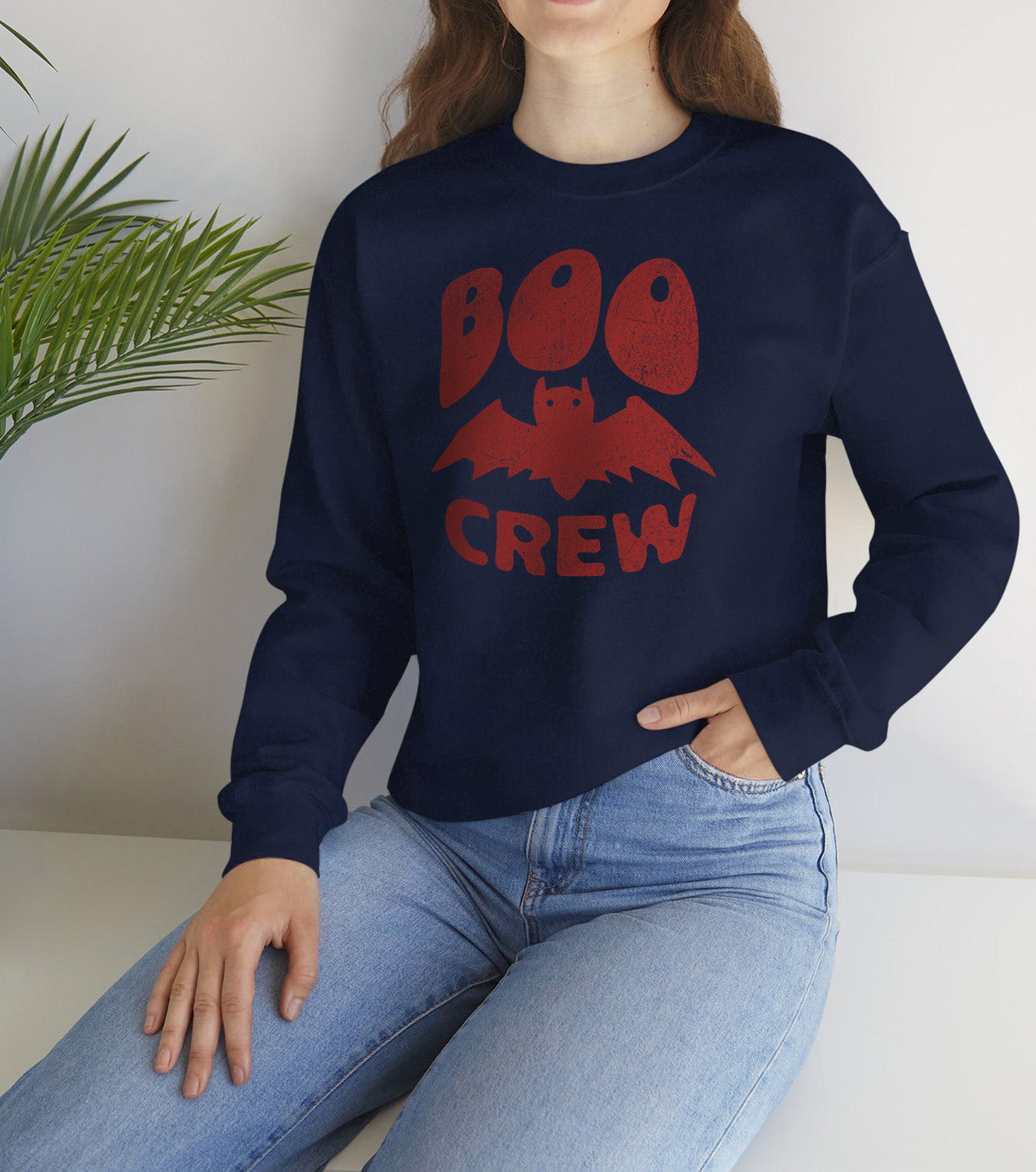 Boo Crew Halloween sweatshirt with cute bat illustration â cozy unisex fall pullover, worn by a spooky vibes fan BimBangDesign