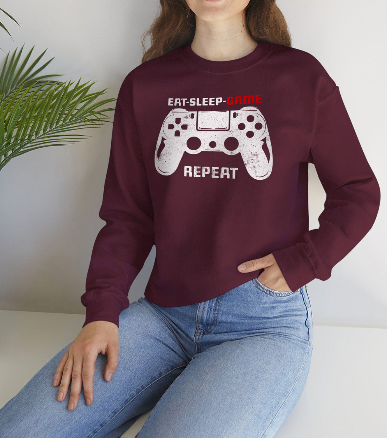 Gamer routine Cozy Sweatshirt Eat Sleep Game Repeat worn by a retro gaming fan BimBangDesin