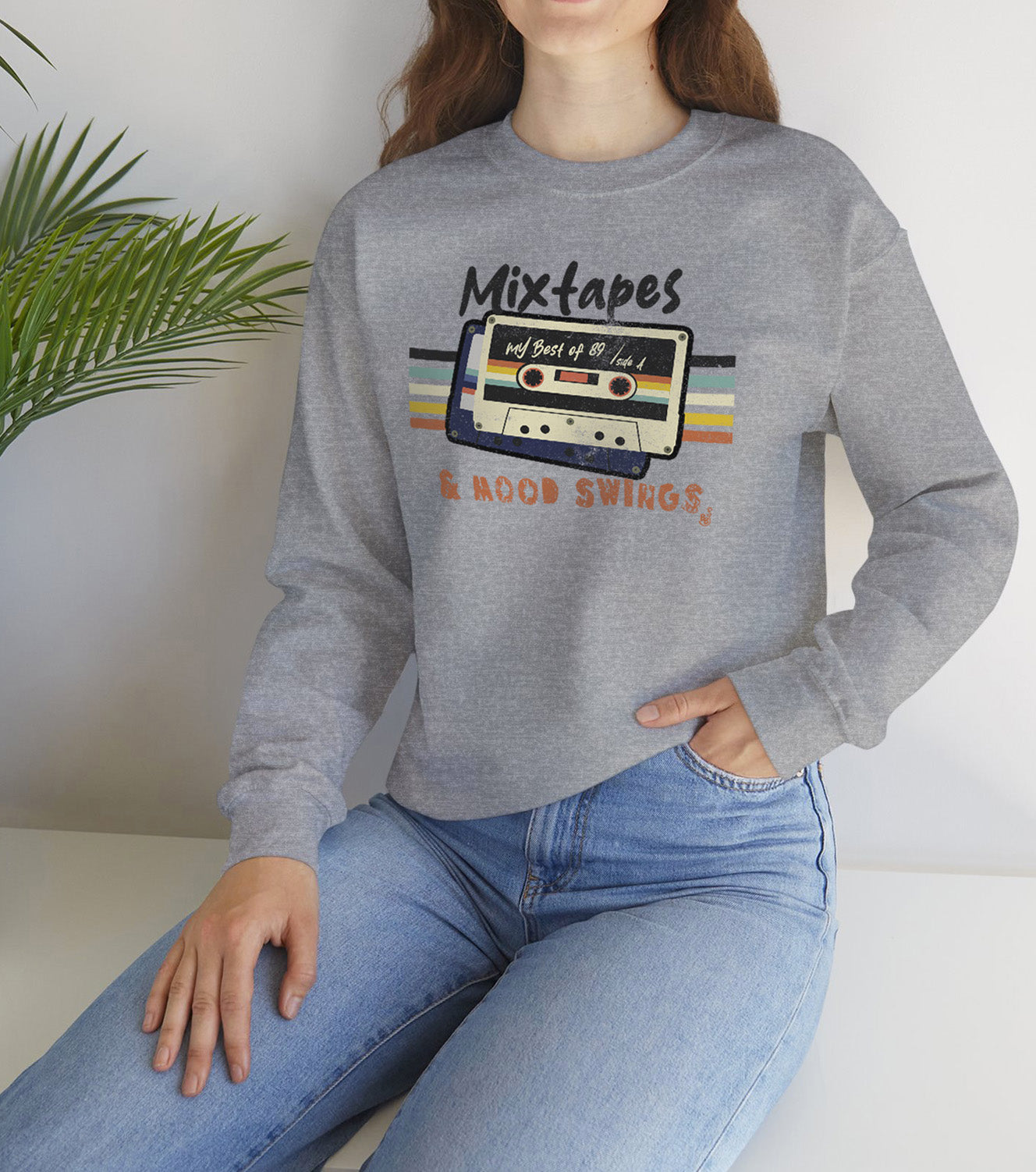 Mixtapes & Mood Swings vintage typography on a Sport Grey Sweatshirt worn by a vintage vibe hunter BimBangDesign