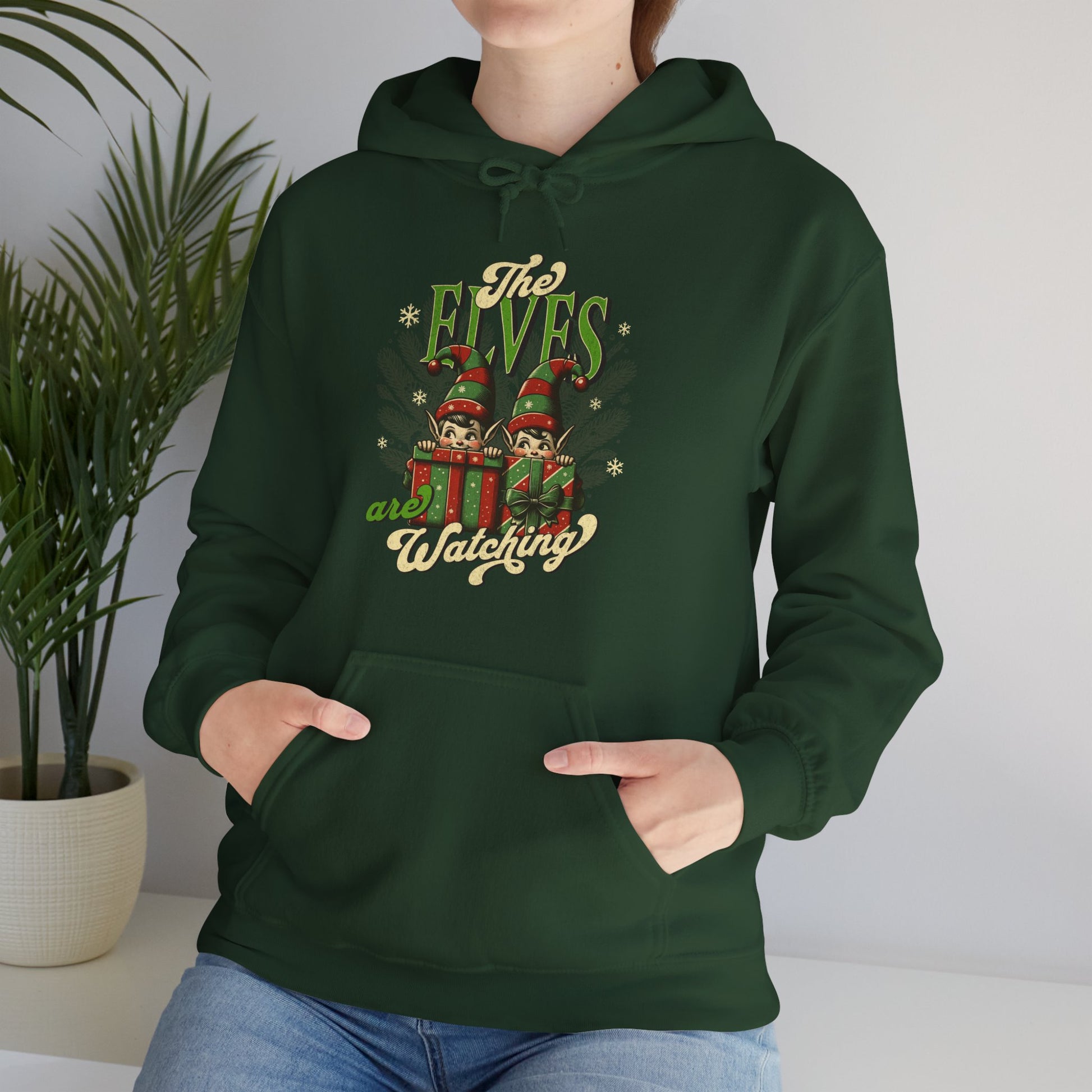 Christmas-themed unisex hoodie styled for winter, featuring fun elf-inspired artwork
