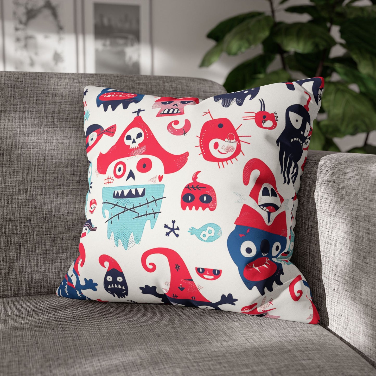 Decorative Pillow on a sofa of naive cartoon quirky little pirate skulls and monster-like characters to be used as home decor accessory BimBangDesign