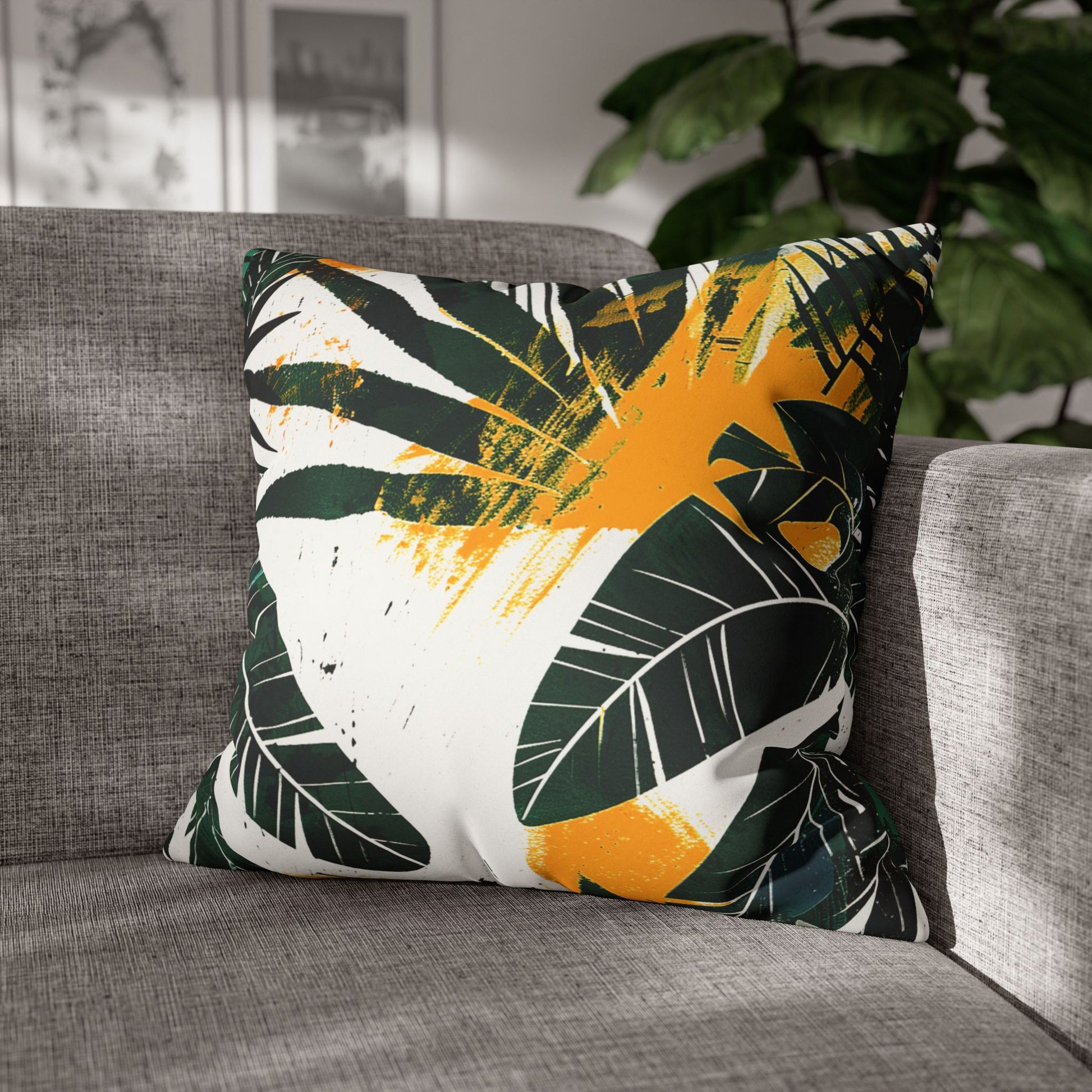 Decorative Pillowcase of lush tropical green foliage with hand-painted ochre-yellow stylish splashes on a sofa used as home decor accessory BimBangDesign
