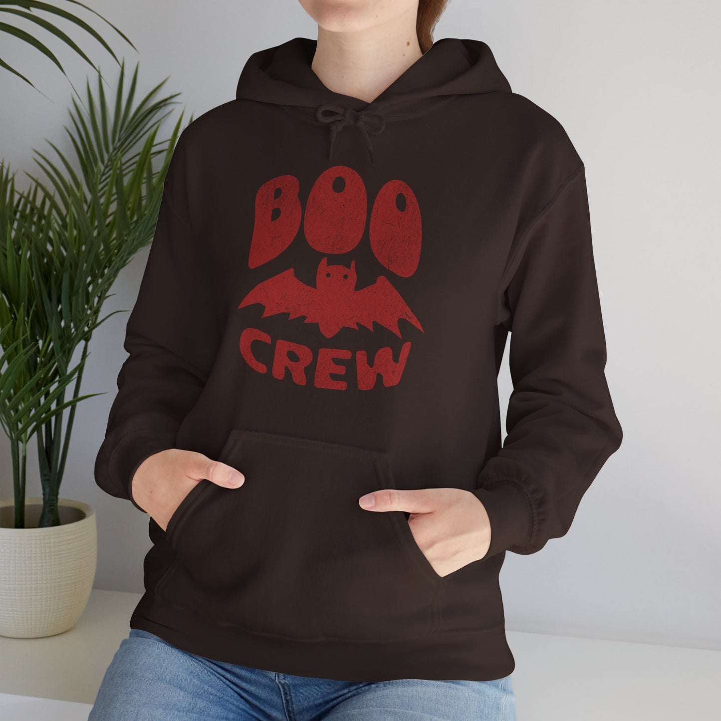Boo Crew Halloween hoodie with cute bat illustration – cozy unisex fall pullover worn by a spooky vibes fan, by BimBangDesign