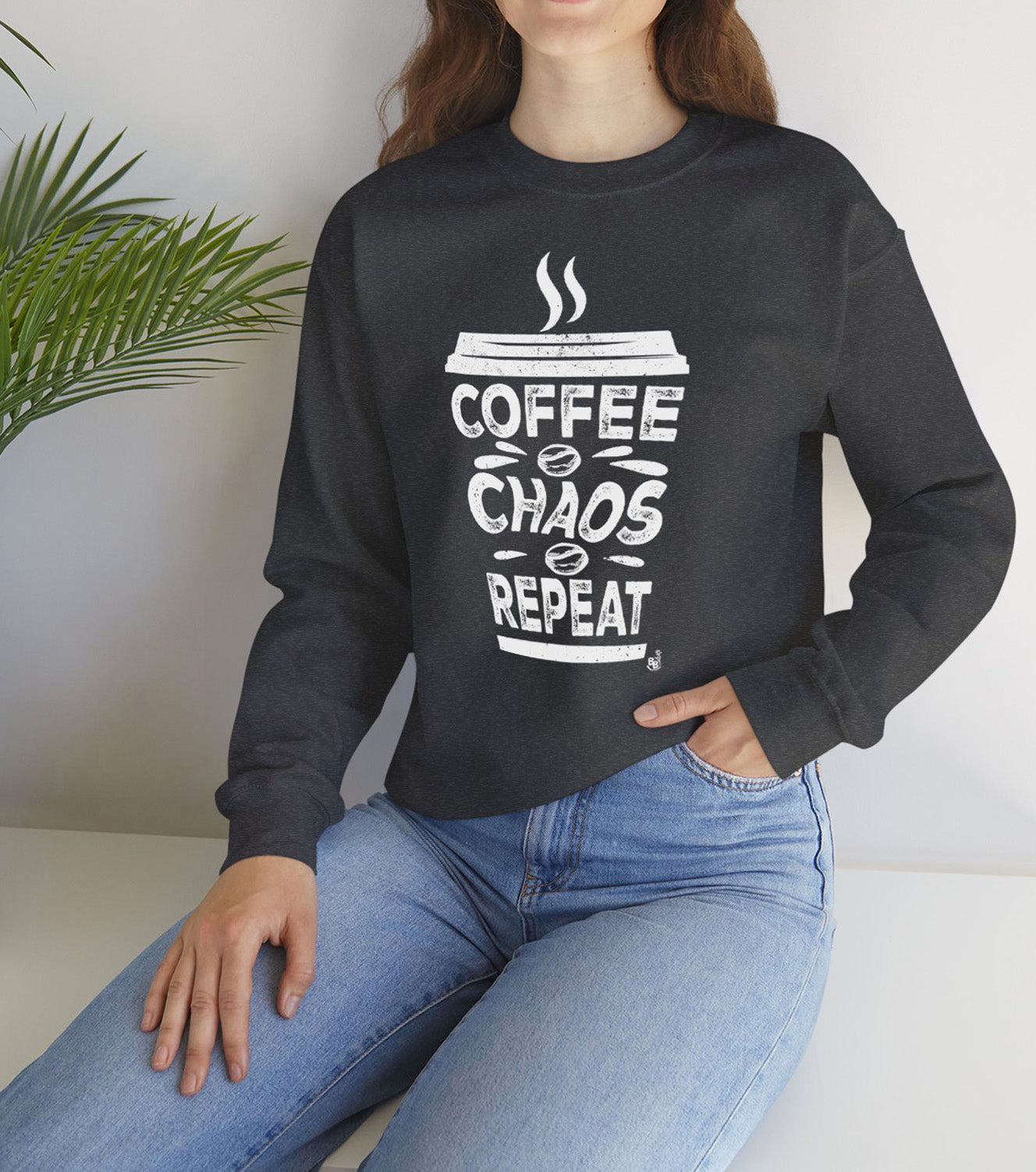 Dark Heather Coffee Chaos Repeat Sweatshirt worn by a coffee lover on the go BimBangDesign 