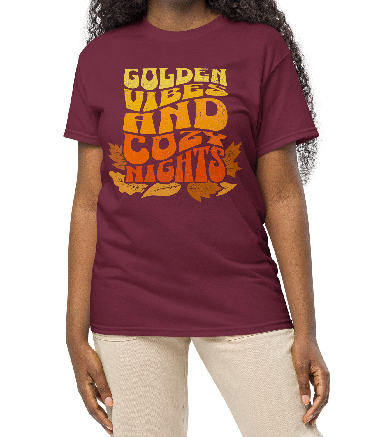 Comfy t-shirt with “Golden Vibes and Cozy Nights” text in yellow-to-orange gradient and autumn leafs BimBangDesign