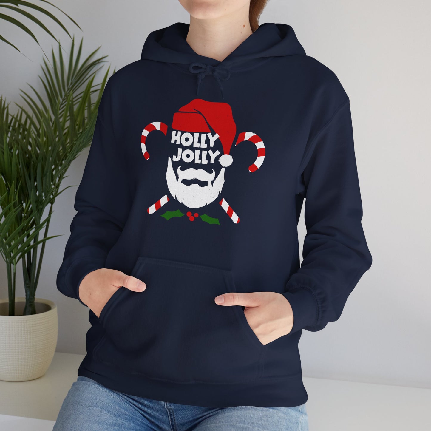 Cozy Unisex Christmas hoodie with warm fleece and festive Holly Jolly print worn by holidays entousiat BimBangDesign