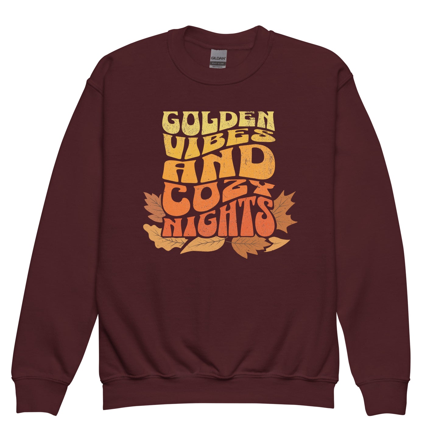 Maroon Kids sweatshirt with colorful “Golden Vibes and Cozy Nights” text and autumn leaves illustration. Cozy fall crewneck for children. BimBangDesign