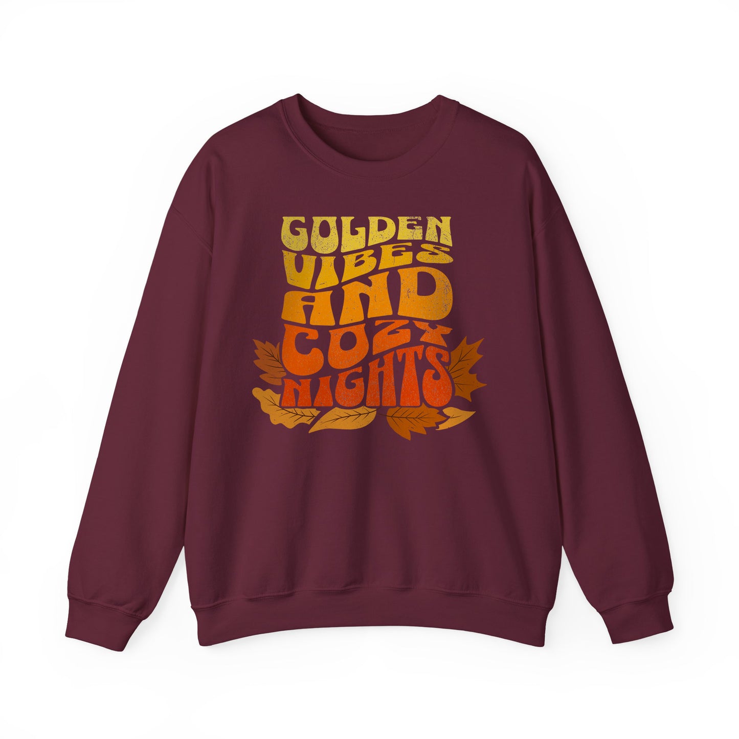 Maroon sweatshirt with “Golden Vibes and Cozy Nights” text in yellow-to-orange gradient and autumn leafs BimBangDesign