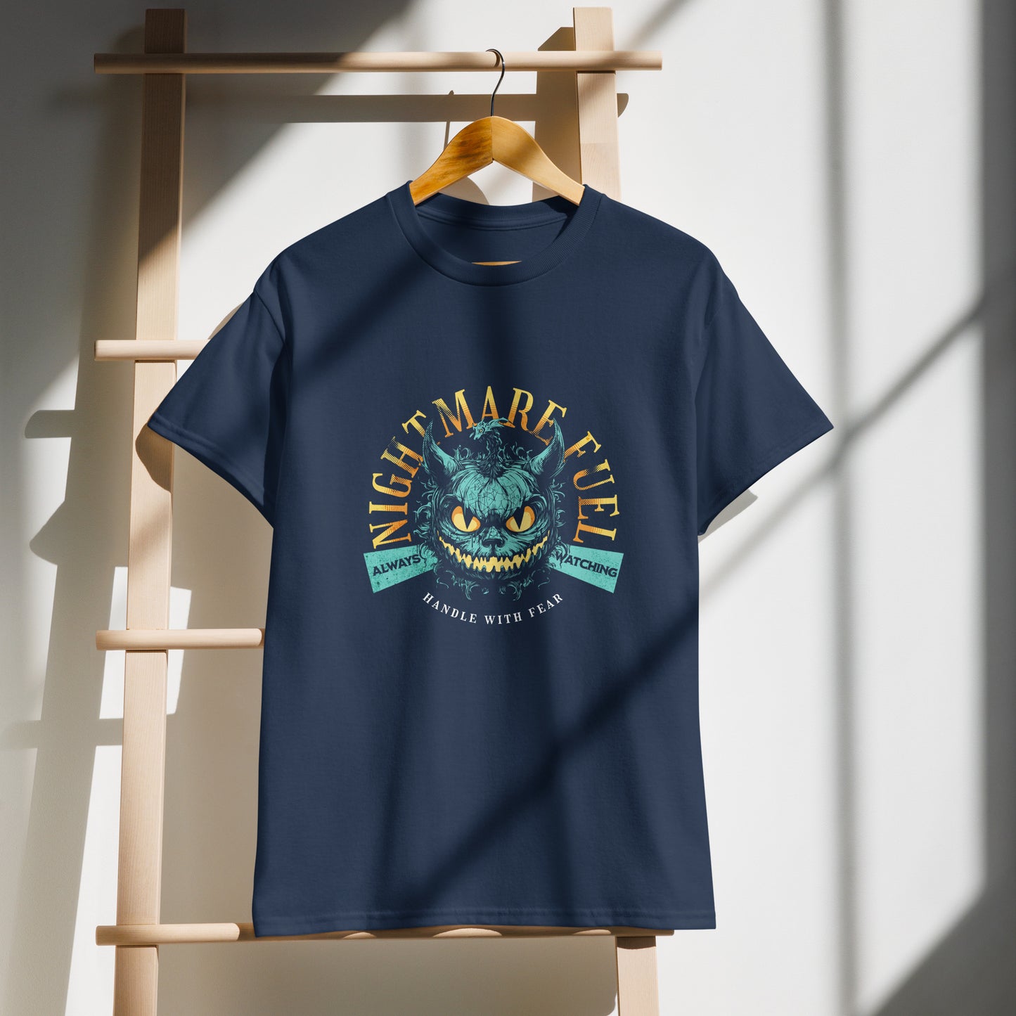 Navy Unisex t-shirt with a creepy-cute monster design and the text “Nightmare Fuel” in demo, by BimBangDesign